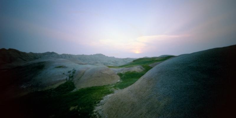 Pinhole image of a Badlands landscape at dusk